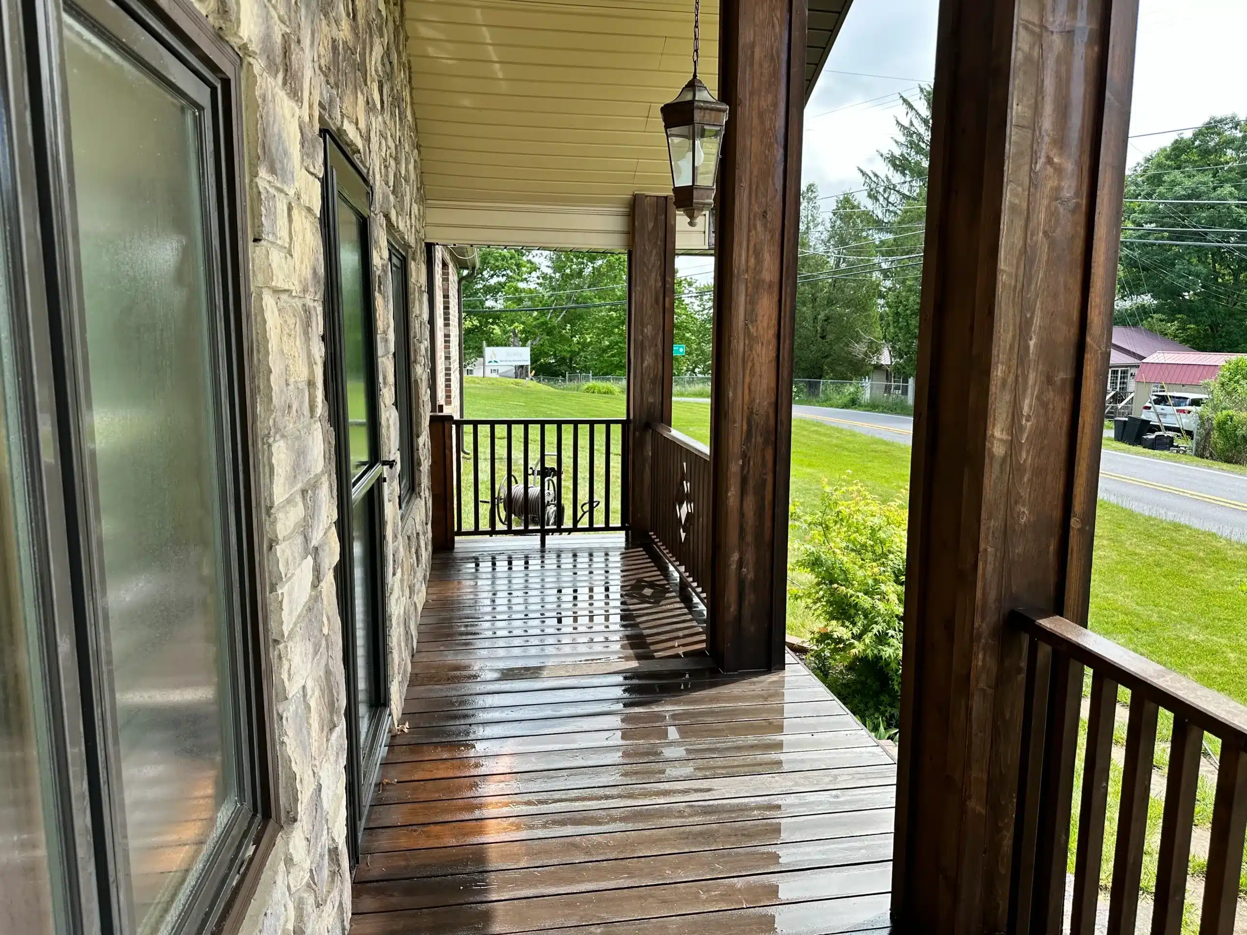 IMG_3435 Front porch with freshly stained wood deck and pillars