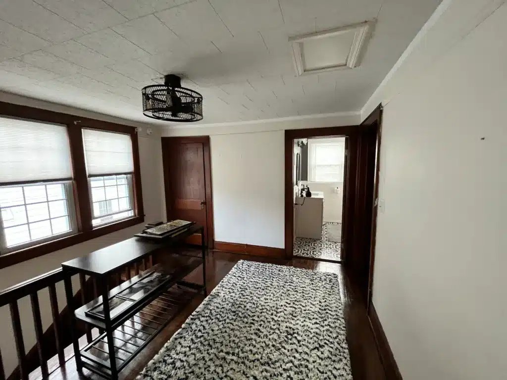IMG_7936 White walls and ceiling with stained wooden trim