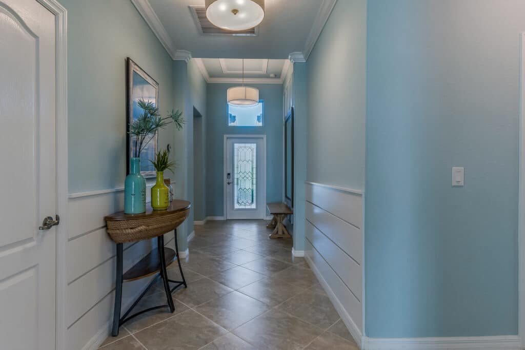 Long corridor leading to front entrance how to choose foyer paint color